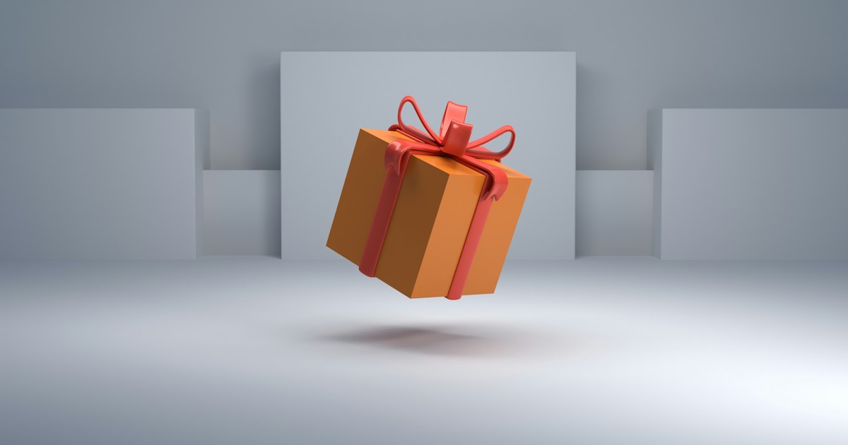 Caja de regalo naranja con lazo rojo flotando